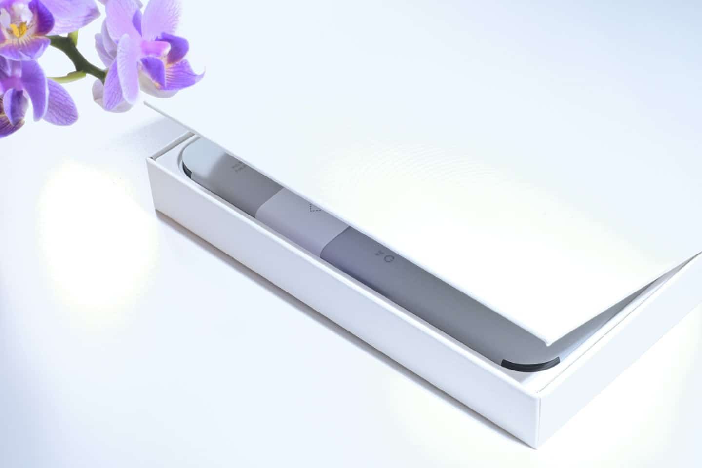 Electronic beauty device displayed in its open retail box.